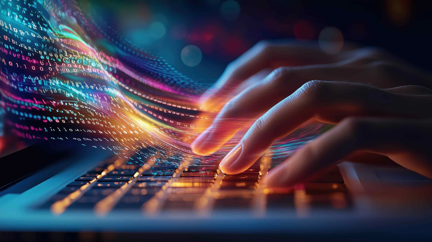 Fingers on a colorful keyboard with lines of data flowing out from them.